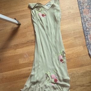Light green dress with embroidered flowers.
